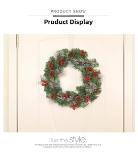 Close-up of a Christmas wreath with pine cones and red berries on a white door