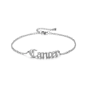 Close-up of silver stainless steel anklet featuring a Gothic 'Cancer' zodiac charm