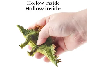Detailed view of flexible stegosaurus toy showing soft hollow texture being squeezed by hand