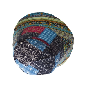 Ethnic patchwork bucket hat with colorful floral patterns and bohemian sun protection style