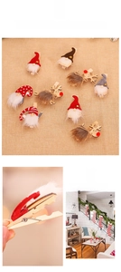 Detailed view of Christmas wooden clips featuring Santa, gnome, and reindeer designs