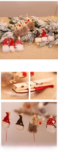 Detailed view of Christmas wooden clips featuring gnomes and reindeer on cedar branches