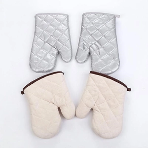 Thick heat resistant oven mitts in silver and beige fabric with diamond quilted pattern