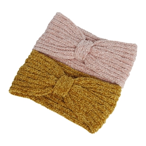 Detail of chenille knitted knot headbands in pink and yellow with soft woven texture