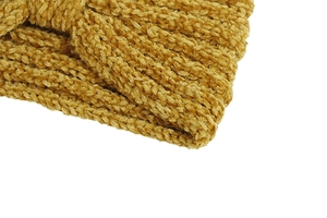 Close-up of mustard yellow chenille knitted headband showing crochet texture and knot