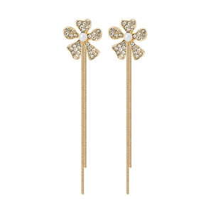 Elegant gold tassel earrings with rhinestone flower and pearls on white background
