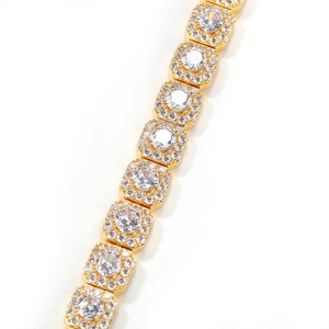 Detailed view of hip hop gold plated bracelet featuring square white zircon stones