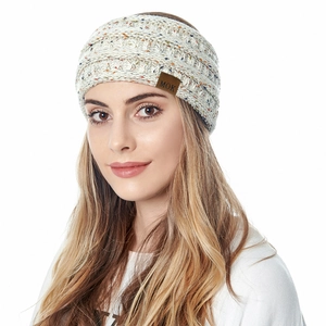 Detail of beige ribbed knit headband featuring a brown MOK leather label for winter