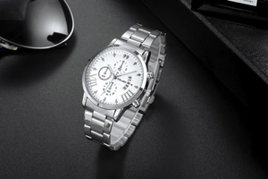 Detail of YOLAKO quartz watch showing three sub-dials and silver stainless steel band
