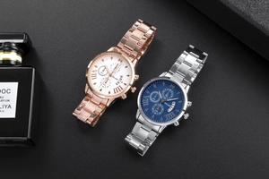 Close-up of YOLAKO quartz watches with roman numerals and metallic link straps