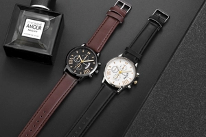 Detail view of Yolako quartz watches with brown and black leather bands and roman numerals