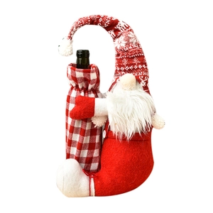 Christmas gnome wine bottle cover in red and white knit fabric for holiday table decor