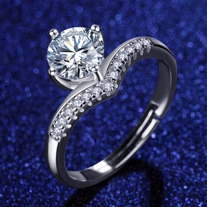 Close-up of a sparkling zircon ring with classic four-prong setting and wave band detail