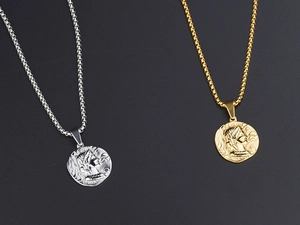 Detailed view of silver and gold titanium steel coin necklaces with Roman relief pendants
