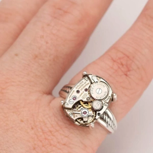 Detail of steampunk ring featuring a real mechanical watch movement and 17 jewels