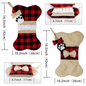 Macro shot of bone-shaped Christmas stockings in red plaid and burlap with size dimensions