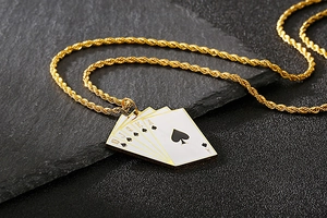 Detailed close-up of golden twist chain and royal flush poker cards pendant with zircon