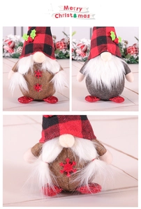 Detailed view of handmade Christmas gnomes with plaid hats and snowflake embroidery