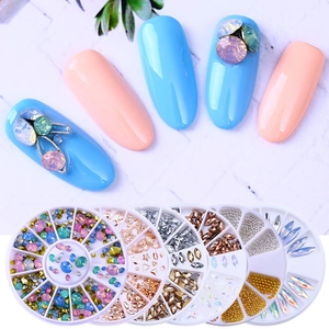 Nail art decoration set with stars moons and rhinestones in various metal shapes