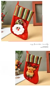 Close-up of 3D Santa and Reindeer Christmas stockings with striped knit cuffs