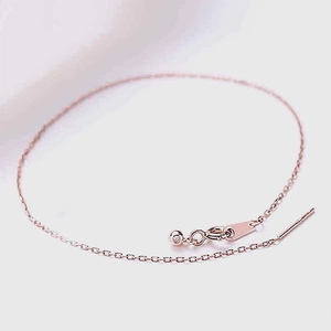 Detail of rose gold stainless steel cable chain bracelet with clasp and metal connectors