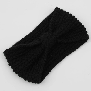 Detail of black corn kernel knit headband featuring a bohemian bowknot texture