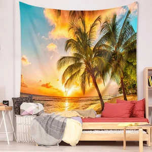 Detail of a tropical sunset beach tapestry with palm trees and ocean on a white wall