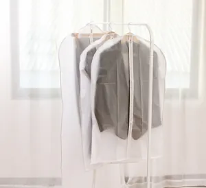 Detail of translucent frosted PEVA garment bags with zipper for dust-proof suit protection