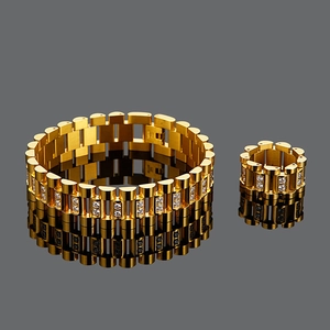 Detailed view of luxury gold chain bracelet and ring set with embedded crystals