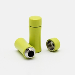 Detailed view of yellow 1:12 scale miniature dollhouse thermos with removable lid