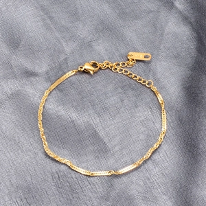 Minimalist 18K gold twisted rope chain bracelet with lobster clasp and adjustable link