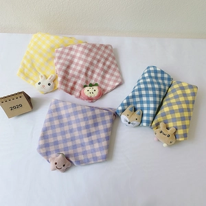 Detail of colorful plaid cotton baby scarves featuring cute plush cartoon animal figures