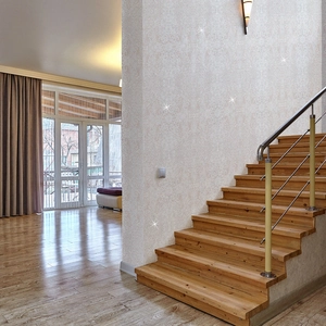 Close-up of beige starlight mosaic tiles applied on a stylish living room wall