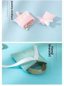 Detailed view of plush jewelry pouches with ribbon ties for necklaces and bracelets