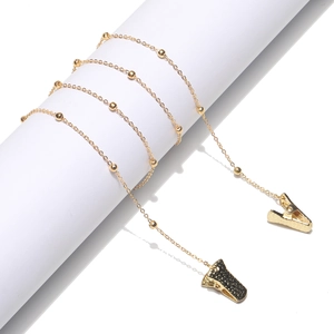 Golden metal bead chain with alligator clips for eyewear and masks shown on a white stand