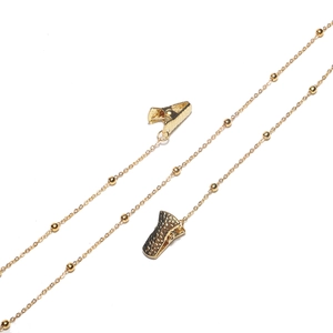 Detail shot of golden beaded mask chain with durable alligator clips at both ends