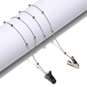Silver bead chain with crocodile clips for masks and glasses on white display stand