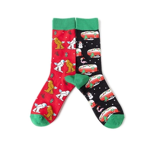 Detail of red and black Christmas crew socks with snowman and reindeer patterns