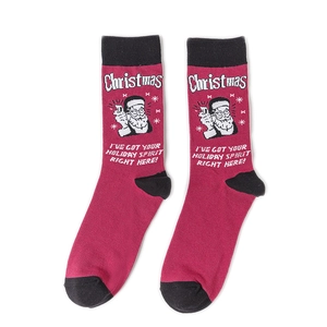 Detail of red Christmas crew socks featuring white text and black knit heels on white backdrop