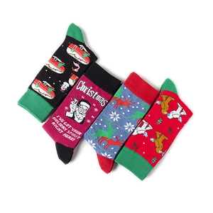 Detail of four festive cotton socks featuring Santa, reindeer, and polar bear patterns