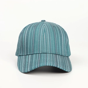 Close-up of textured blue striped fabric and stitching on a curved baseball cap brim