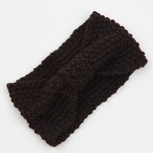 Detail of chunky knit headband with a twist knot design in chocolate brown yarn