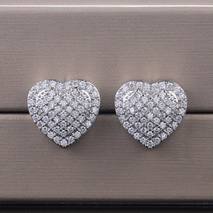 Macro view of sterling silver heart earrings with micro-pave cubic zirconia setting