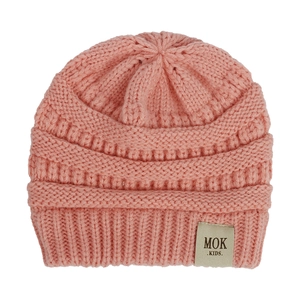 Close-up of pink knit baby beanie showing detailed wool texture and MOK KIDS label