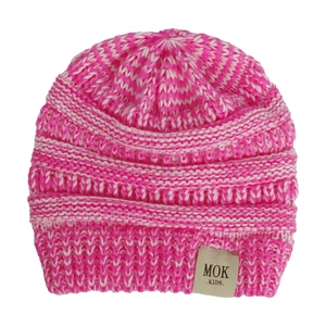 Detail of rose pink and white striped knit beanie showing premium chunky knit texture