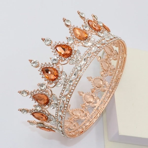 Macro side view of rose gold bridal crown with amber teardrop stones and white rhinestones