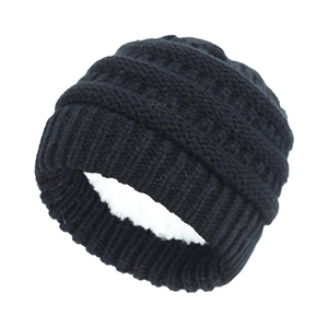 Detail of black knit beanie for kids showing warm white fleece lining and thick weave