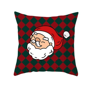 Christmas pillowcase with Santa Claus pattern on red and green checkered background