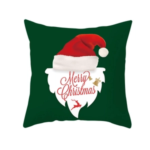 Detail of Christmas pillow cover with festive reindeer, Santa motifs and Merry Christmas text