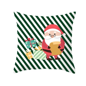 Detail of Christmas pillowcase featuring Santa Claus with gifts on green striped background